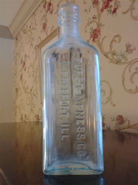 A tamper-proof top that shows whether a bottle has been. . Furst mcness co bottle